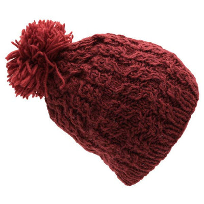 Red knitted beanie with a pom-pom on a white background