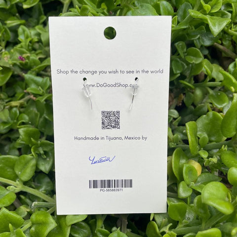 Earring tag on a green leaf background