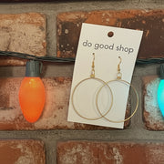 Earring cards with earrings on a brick wall background