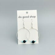 boho silver hoop Earrings on a 'do good shop' card against a gray background