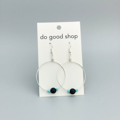boho silver hoop Earrings on a 'do good shop' card against a gray background