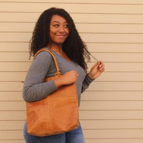 african american black woman modeling Genuine Leather Handbag with lipstick pouch - do good shop